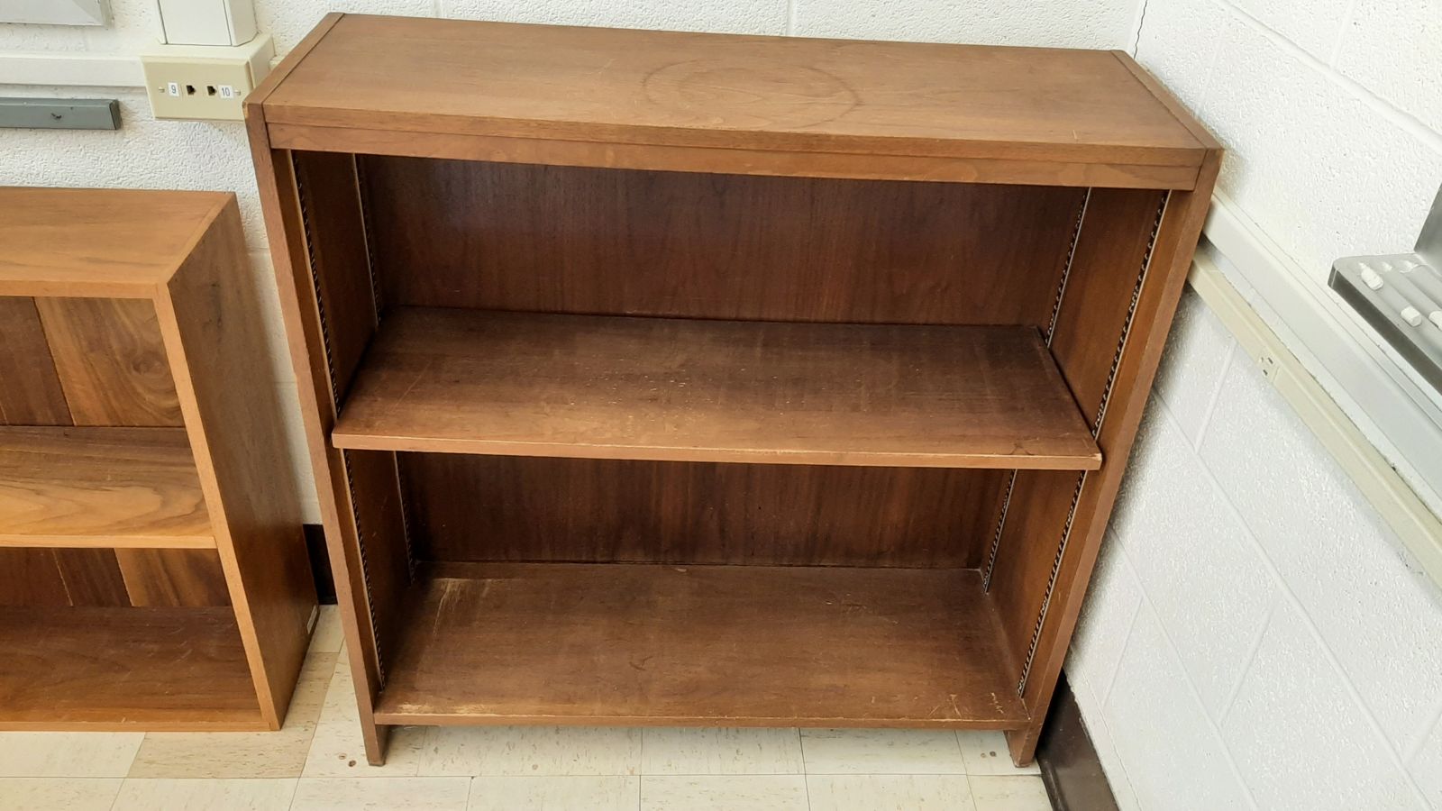 An image of a 2-shelf wood bookcase.