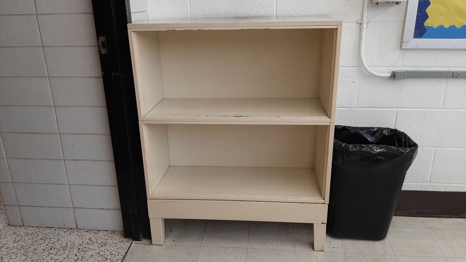 An image of a 2-shelf metal bookcase.
