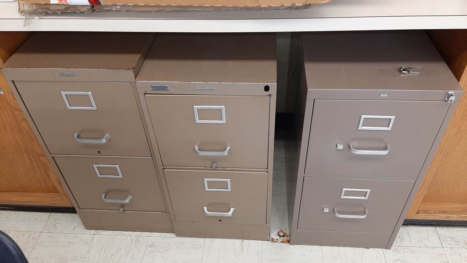 An image of three 2-drawer filing cabinets.