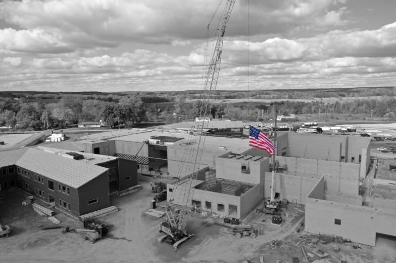 The American flag flies at the new campus construction site.