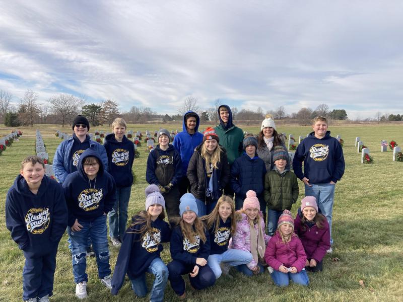 Students pose for a group picture at the Ohio Western Reserve National Cemetery.