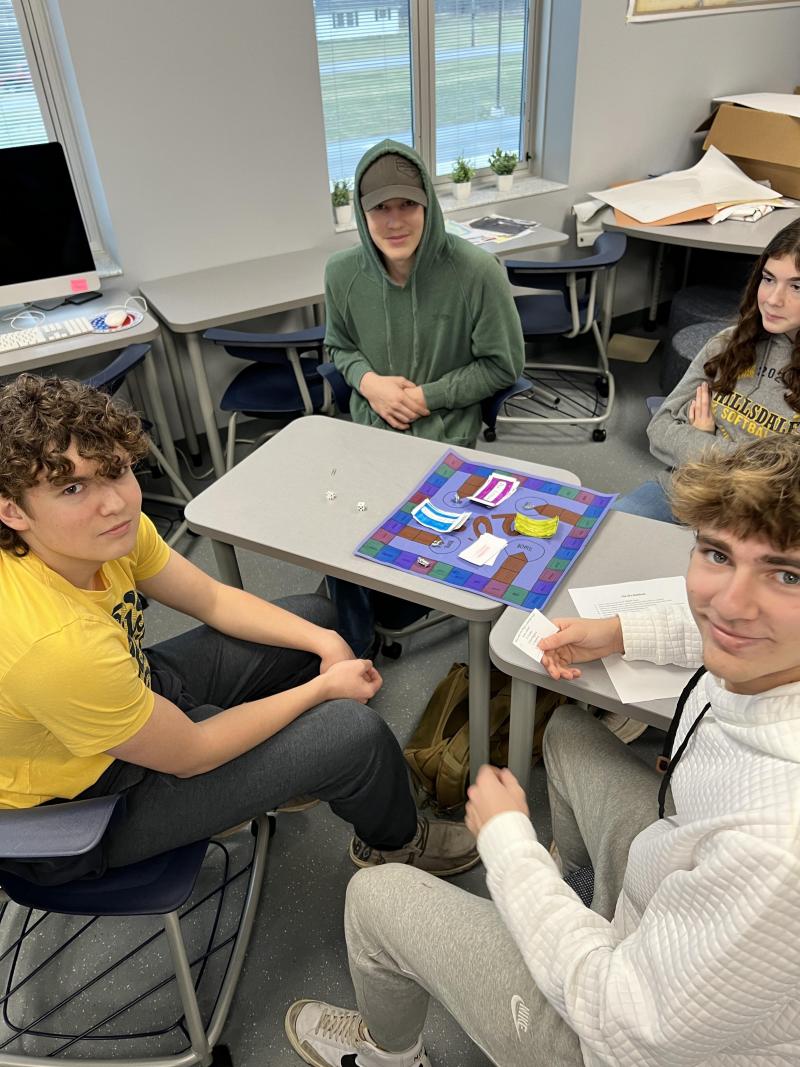Students work on their games in the classroom.
