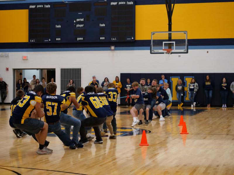 An image of students in a tug-of-war contest.
