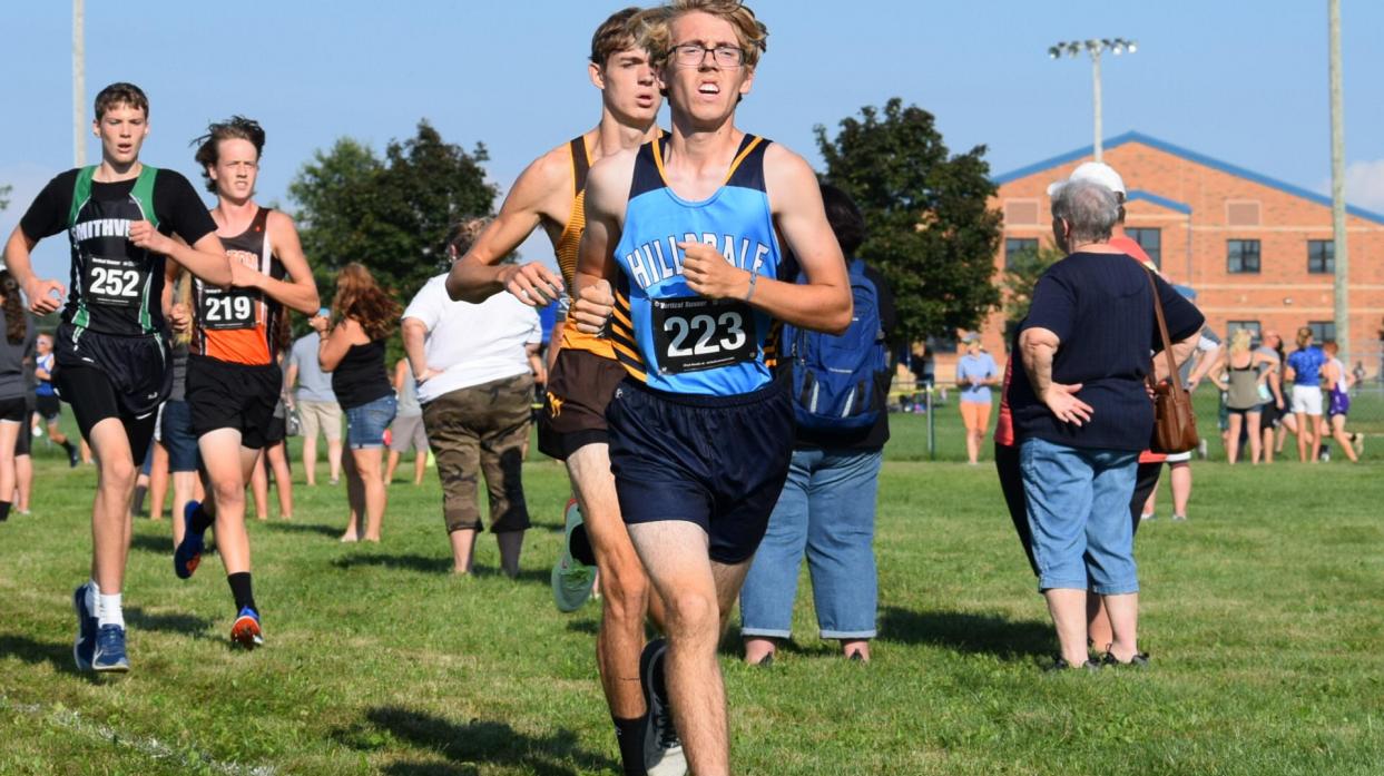 An image of a cross country runner during a race.