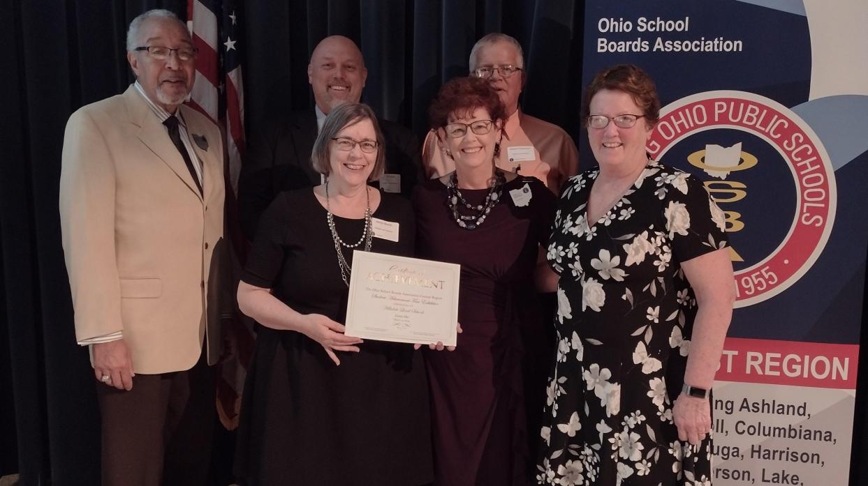 Mrs. Jenny Stump is presented with a certificate for her students' participation in OSBA Student Achievement Fair.
