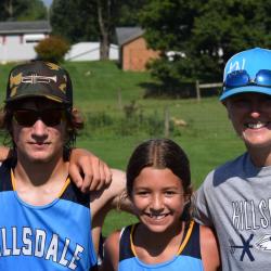 An image of the cross country runners and the coach.