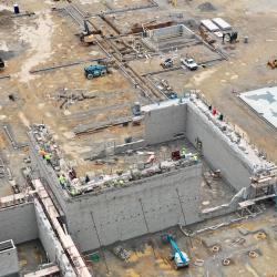 an overhead drone shot of the interior of the preK-12 building in various stages of early work