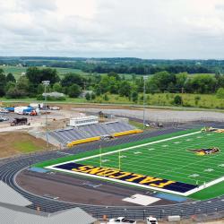 The field house at the new athletic complex is pictured in the foreground of this photo and the track and field in the background.