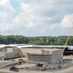 The new educational building under construction as part of the new campus with the ramp and steps leading to the athletic complex