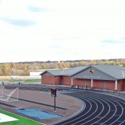 A close-up from the opposite side of the field house, track, long jump, pole vault and south end zone