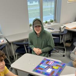 Students work on their games in the classroom.