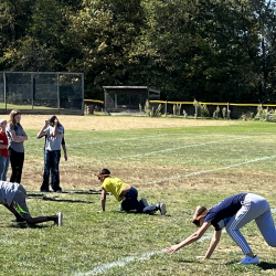 Students participate in the bear crawl relay.