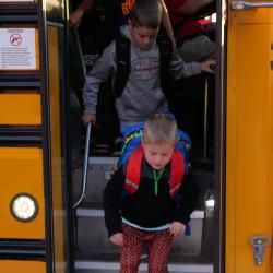 An image of students exiting the bus.