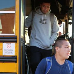 An image of students exiting the bus.