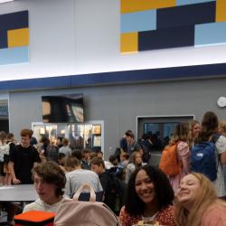 An image of students sitting in the cafeteria.