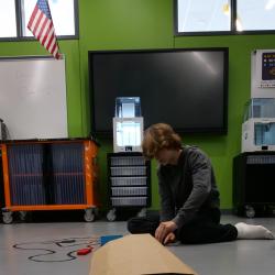A student works on the course for the finchbot to travel.