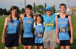 An image of the cross country runners and the coach.