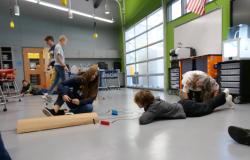 Students watch the finchbot move through the mini tunnel.